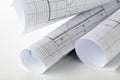 Rolls of architectural blueprint house building plans on white table Royalty Free Stock Photo