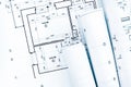 Rolls of architectural blueprints and project plan on architect Royalty Free Stock Photo