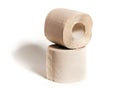 Rolls of beige toilet paper isolated