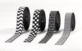 Rolls of black and white patterned elastic bands