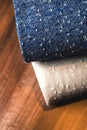 Rolls of blue and brown fabric on wooden Royalty Free Stock Photo