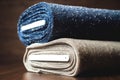 Rolls of blue and brown fabric on wooden Royalty Free Stock Photo