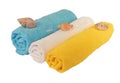 Rolls of blue, white, yellow towels with sea shells isolated Royalty Free Stock Photo