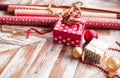 Rolls of Christmas wrapping paper with ribbons, gifts and bolls Royalty Free Stock Photo