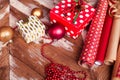 Rolls of Christmas wrapping paper with ribbons, gifts and bolls Royalty Free Stock Photo