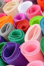 Rolls of colored fabrics. Color felt bright colors.