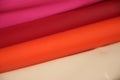 Rolls of colored plastic tape. Pink, wine red, tomato beige