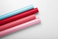 Rolls of colorful wrapping papers on white background, top view Royalty Free Stock Photo