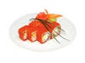 Rolls with crab, avocado and tobiko on white round plate