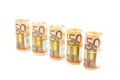 Rolls of euro notes in row on white Royalty Free Stock Photo