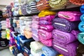 Rolls of fabri and textiles in a factpory shop.