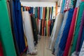 Rolls of fabric and textiles in an eastern textile shop.