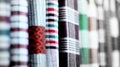 Rolls of fabric and textiles in a factory shop. Multi different colors and patterns on the market Royalty Free Stock Photo