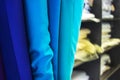 Rolls of fabrics blue tan.Textile market stall