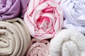 Rolls of fabrics.Closeup of silk, cotton,knitwear, corrugated fabrics as a background