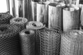 Rolls of galvanized metal sheets, steel chicken wire mesh, and p Royalty Free Stock Photo