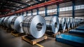 Rolls of galvanized sheet steel in the factory. Large rolls of metal coils in the warehouse.