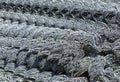 Rolls of galvanized steel wire mesh with a large cell and twisted pattern close-up. In the category of texture, screen Royalty Free Stock Photo