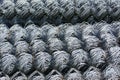 Rolls of galvanized steel wire mesh with a large cell and twisted pattern close-up. In the category of texture, screen Royalty Free Stock Photo