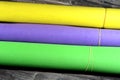 Rolls of glittered colorful Eva foam sheets, colored cardboard, rubber pad, sponge papers for school arts and crafts, pile of