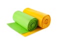 Rolls of green and yellow garbage bags on white background Royalty Free Stock Photo