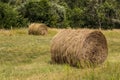 Rolls of haystack on the field, after harvesting wheat. Royalty Free Stock Photo