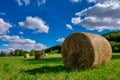 Rolls haystacks straw on field