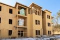 Rolls of Insulation Await Installation In New Apartment Complex construction