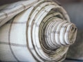 Rolls of linen on the shelf of the fabric store Royalty Free Stock Photo