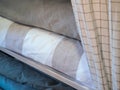 Rolls of linen on the shelf of the fabric store Royalty Free Stock Photo