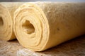Rolls of mineral wool filling used as isolation in wall