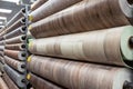 Rolls of new linoleum on the window of a hardware store. A large selection of linoleum