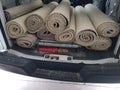 Rolls of old carpet in the truck for installation