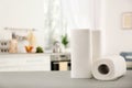 Rolls of paper towels on table Royalty Free Stock Photo