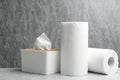 Rolls of paper towels and tissues on marble table Royalty Free Stock Photo