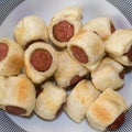 Rolls of puff pastry filled with wurstels Royalty Free Stock Photo