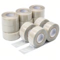 Rolls of regular adhesive tape isolated on white Royalty Free Stock Photo