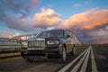 Rolls-Royce Cullinan on the bridge during the evening storm Royalty Free Stock Photo