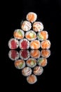 Rolls with salmon, rice, nori, fresh salmon. A pyramid of rolls.