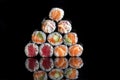 Rolls with salmon, rice, nori, fresh salmon. A pyramid of rolls.