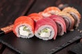 Rolls set with fish salmon and shrimp and tuna maguro eel sushi with chopsticks close-up - asian food and japanese Royalty Free Stock Photo