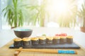 Rolls with shrimp in a black plate on a wooden table. Sushi closeup Royalty Free Stock Photo