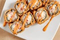 Rolls with shrimps, cream cheese, tomatoes and Spicy sauce in white plate top view Royalty Free Stock Photo