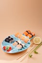 Rolls and sushi on a plate in the form of fish Royalty Free Stock Photo