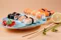 Rolls and sushi on a plate in the form of fish Royalty Free Stock Photo