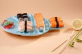 Rolls and sushi on a plate in the form of fish Royalty Free Stock Photo