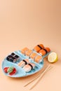 Rolls and sushi on a plate in the form of fish Royalty Free Stock Photo