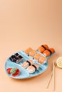 rolls and sushi on a plate in the form of fish Royalty Free Stock Photo