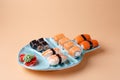 rolls and sushi on a plate in the form of fish Royalty Free Stock Photo