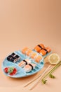 rolls and sushi on a plate in the form of fish Royalty Free Stock Photo